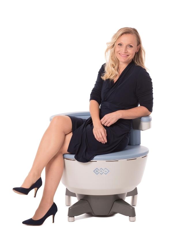 Woman Sitting on Emsella Chair - Non-Invasive Incontinence Treatment